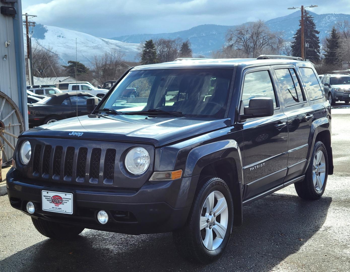 2014 Blue /Black Jeep Patriot Latittude (1C4NJRFB7ED) with an 2.4L I4 engine, 6 Speed Automatic transmission, located at 450 N Russell, Missoula, MT, 59801, (406) 543-6600, 46.874496, -114.017433 - Nice 4WD SUV. Heated Seats.6 Speed Automatic Transmission. 2.4L I4 Engine. Air. Cruise. Tilt. AM FM CD Satellite Radio. Firestone All-Season Tires. Power Windows and Locks. - Photo#1